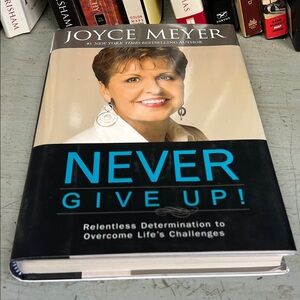 'Never Give Up!' Hardcover Book